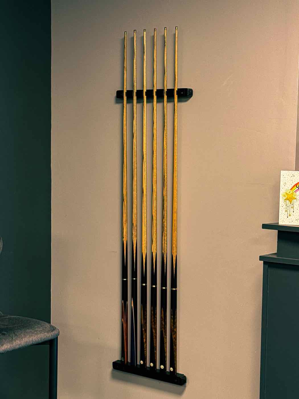 Wall-mounted cue rack at Rackzz Pool Club, Dundalk